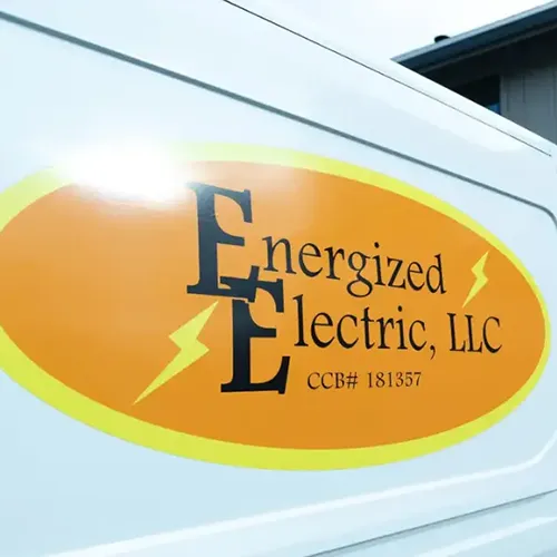 Energized Electric LLC company work van displaying their logo
