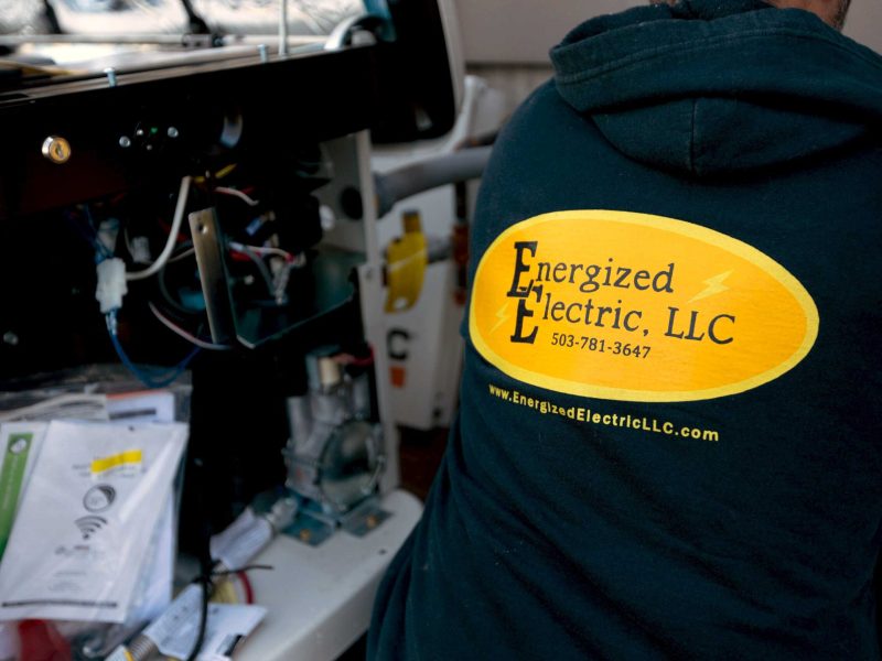 EE-employee-pvc-pipe-3 Close up Energized electric logo on the back of a hoodie